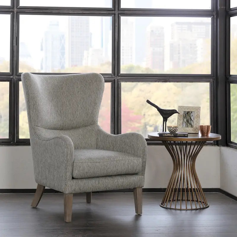 Poltrona Swoop Mid-Century Modern con schienale ad ali in tessuto grigio e gambe in legno massello