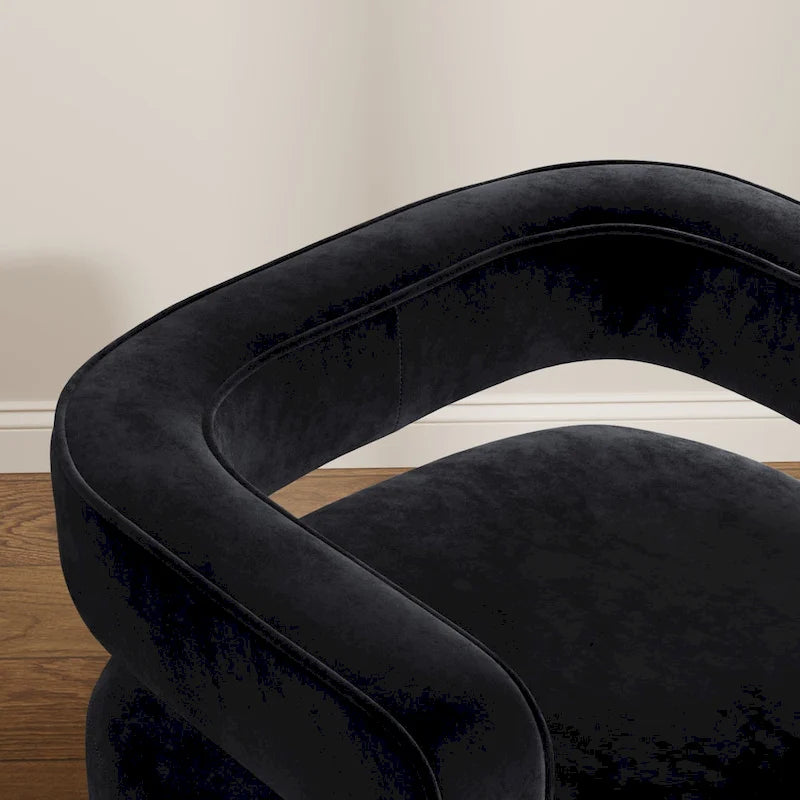 Poltrona girevole a 360° in velluto nero con schienale aperto e base dorata